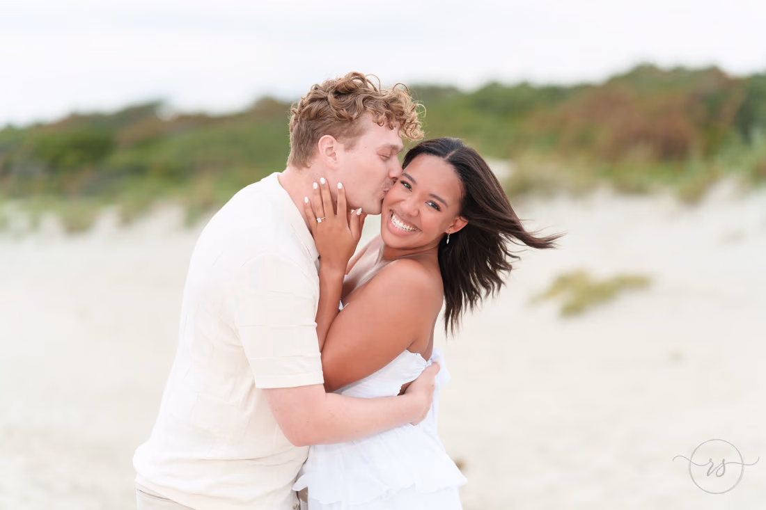 Kiss on the cheek showing off the engagement ring - Myrtle Beach