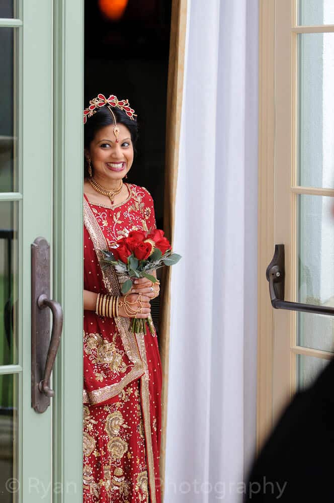 Happy Indian bride first look at ceremony
