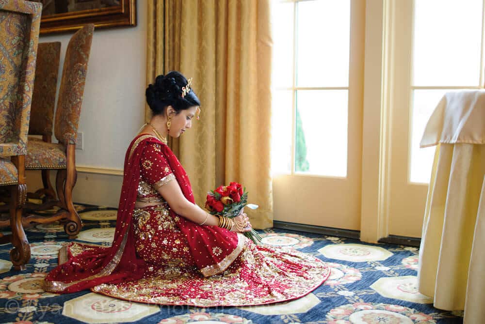 Indian bride looking at flowers