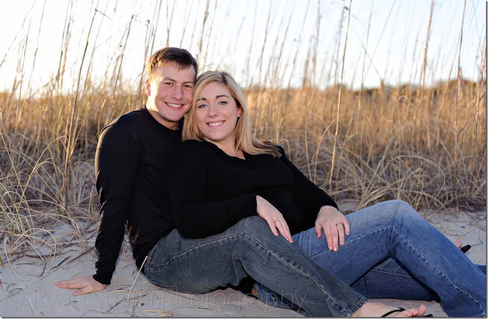 Couple laying by the dunes