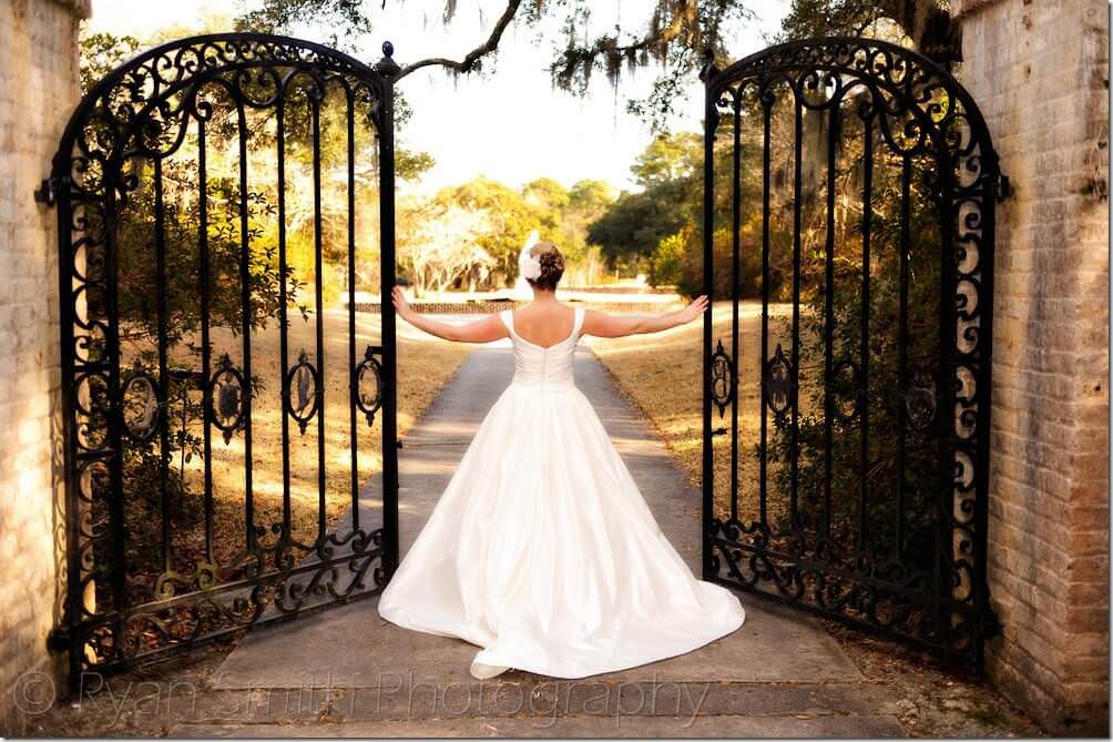 Bride walking through gates - Brookgreen Gardens - Holiday Cottage