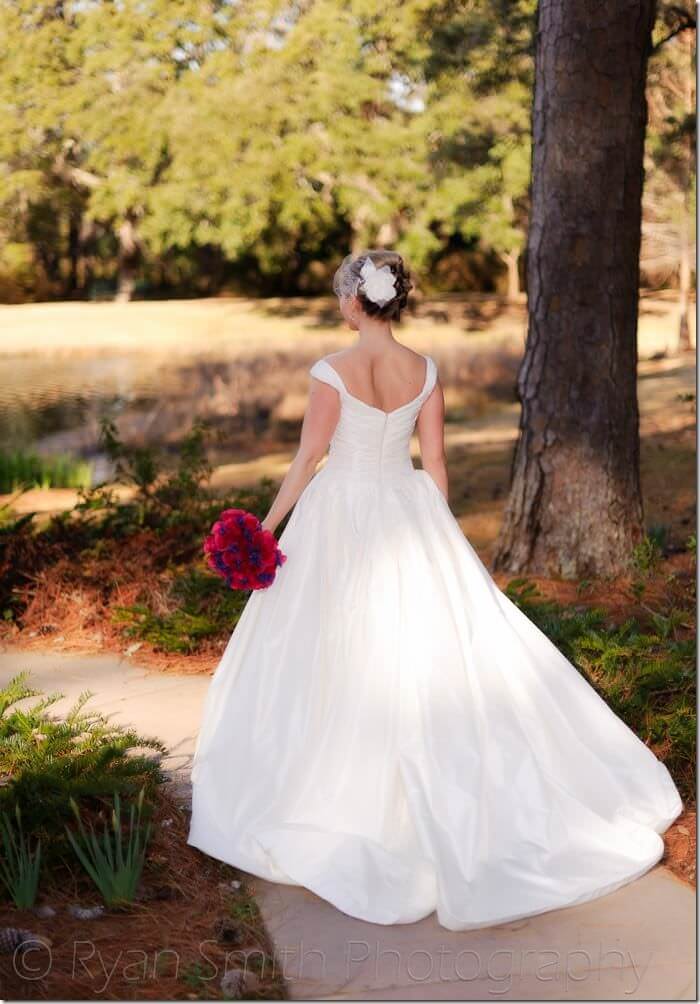 Bride walking towards cottage lake