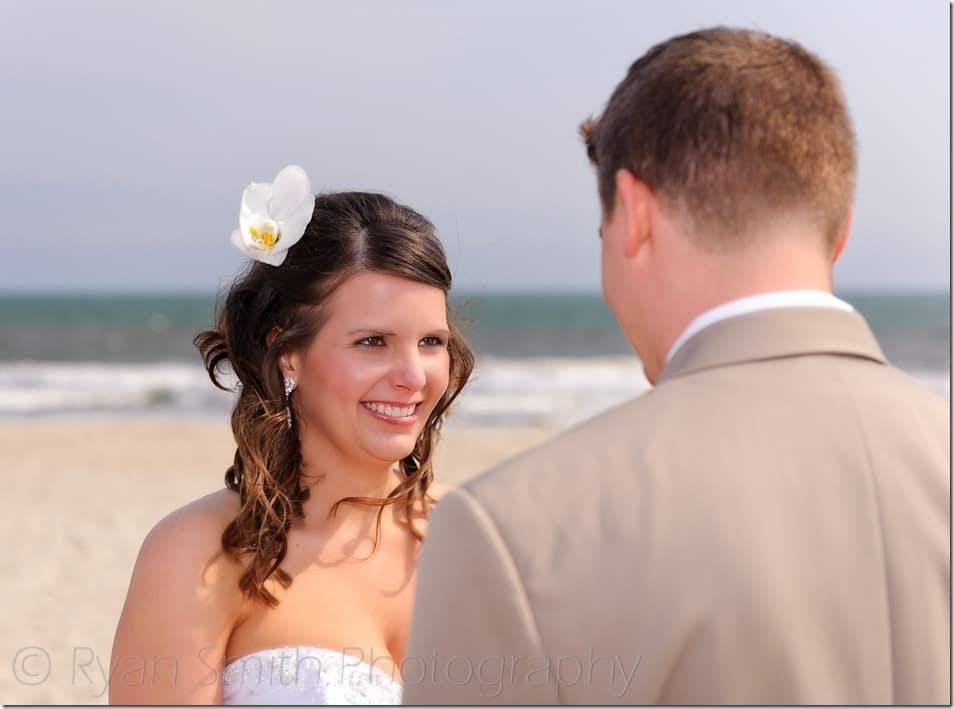 Bride smiling at groom during ceremony - Ocean Isle Beach - NC