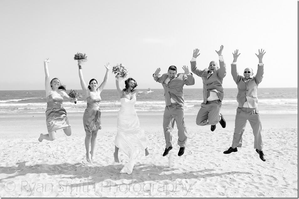 Wedding party jumping in the air