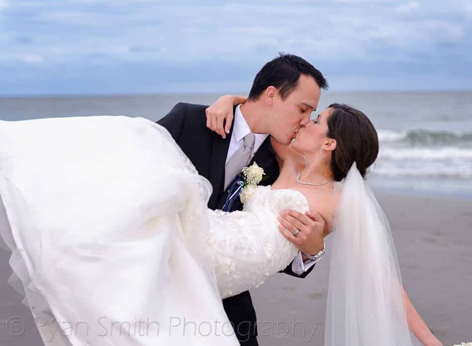 Groom picking up bride for a kiss - Kingston Plantation - North Myrtle Beach