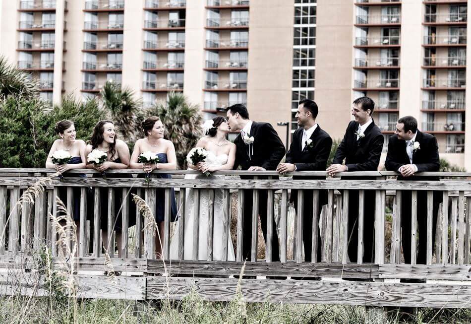 Kiss in front of the bridal party - Kingston Plantation - North Myrtle Beach