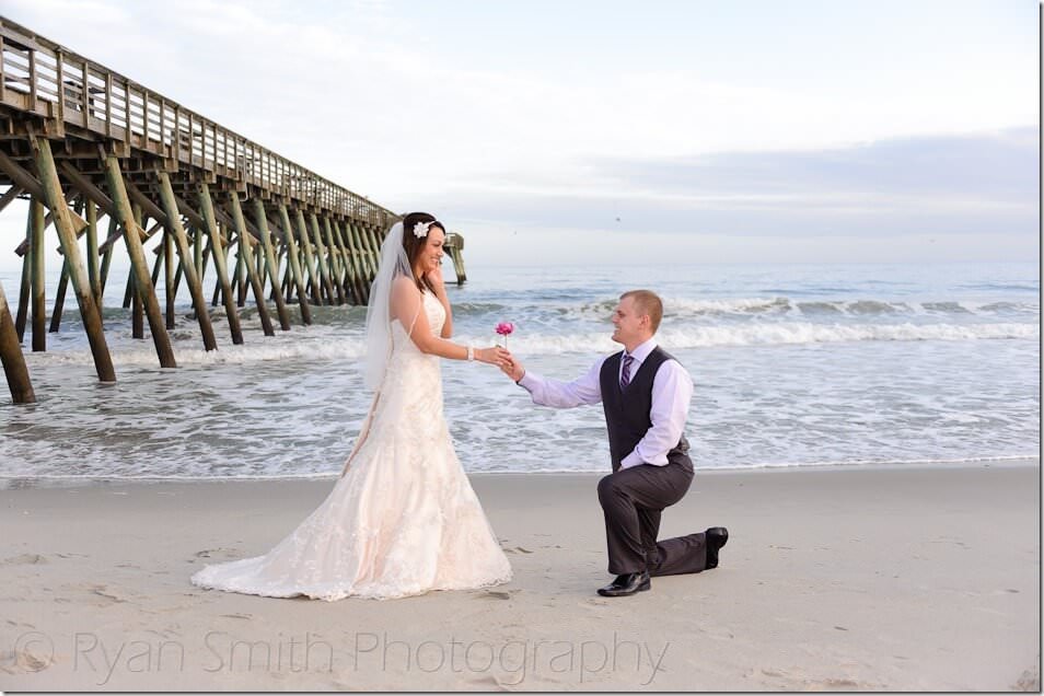 Groom giving bride a flower