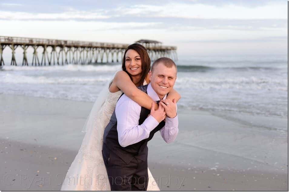 Bride getting a piggy back ride