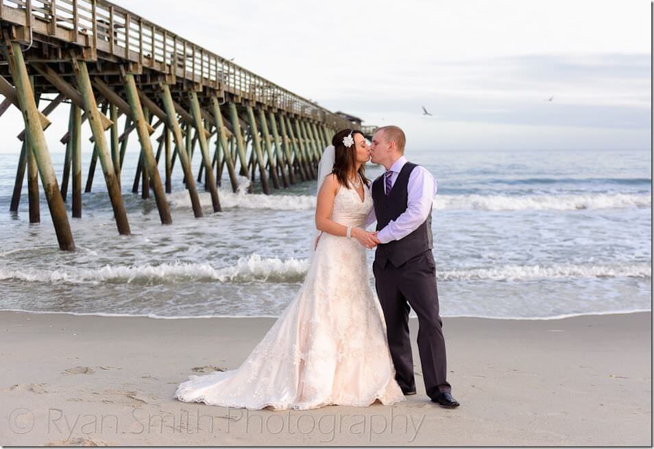 Kiss in front of the Myrtle Beach State Park pier