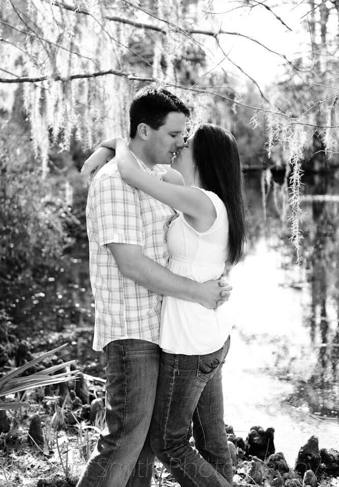 Kiss in front of a lake, push process black and white  - Magnolia Plantation Charleston 
