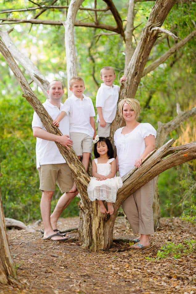 Cute family of 5 standing around the old tree - Myrtle Beach State Park