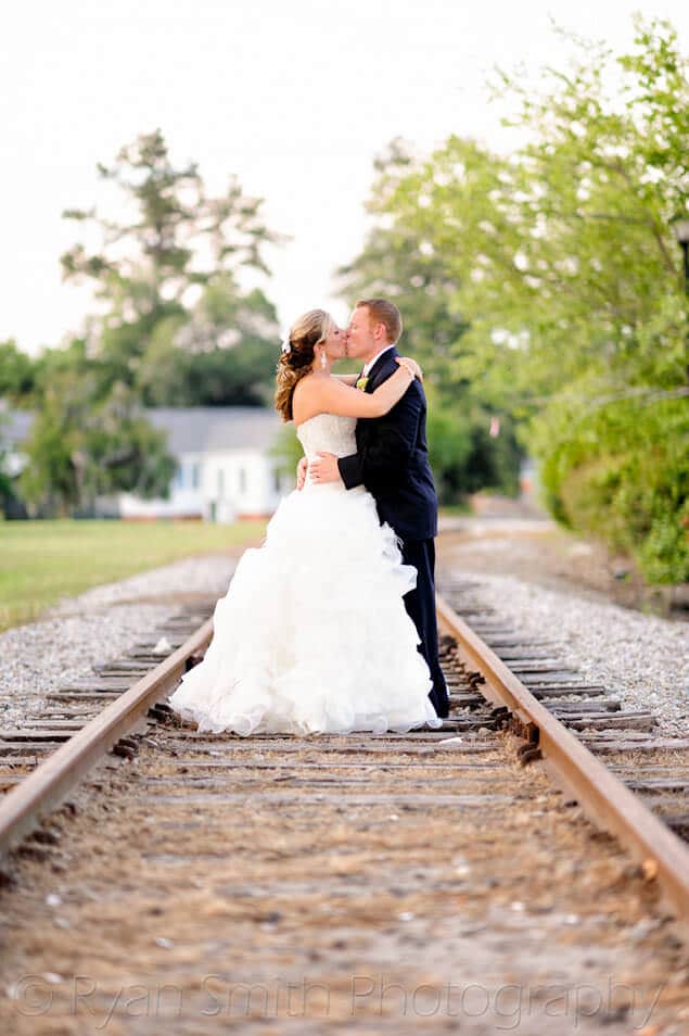 Bride and groom on the train tracks - Conway River Walk