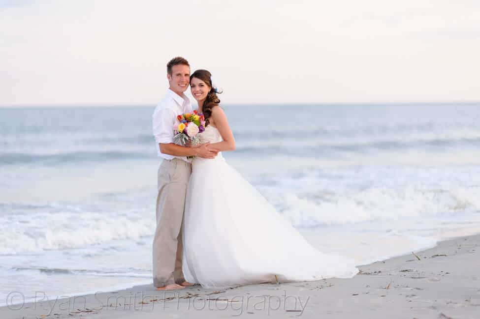 Bride and groom in the edge of the ocean - Ocean Isle