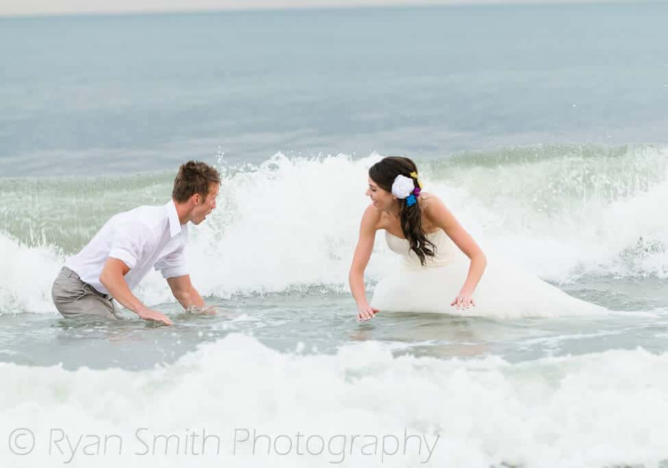 Bride and groom getting ready to ride a wave - Ocean Isle