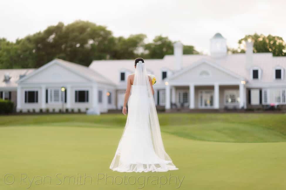 Bride walking toward to clubhouse - Pawley's Plantation