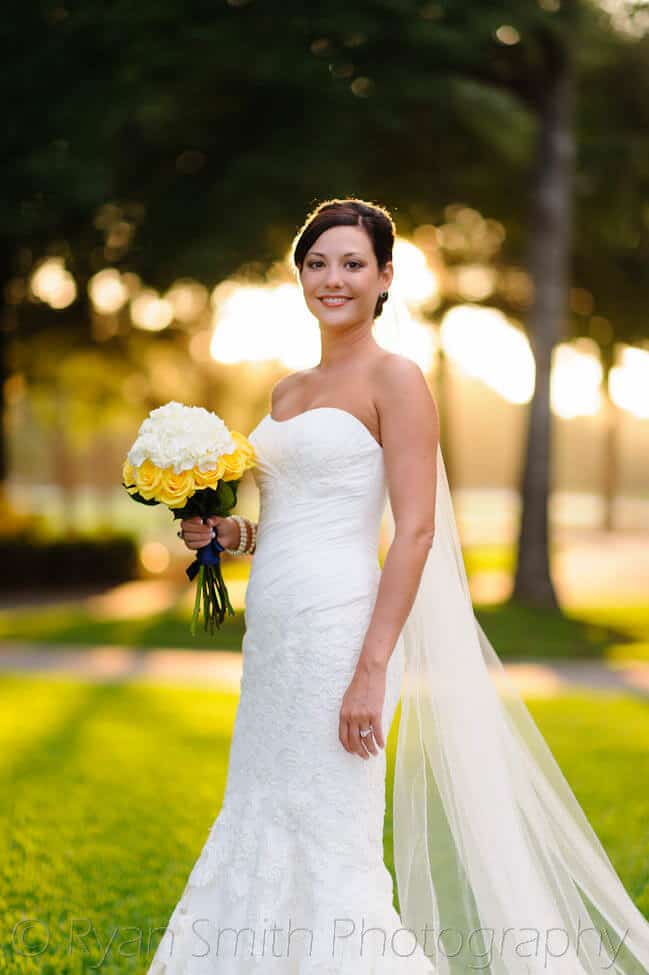 Bride backlit by sunlight coming through the trees -Pawley's Plantation