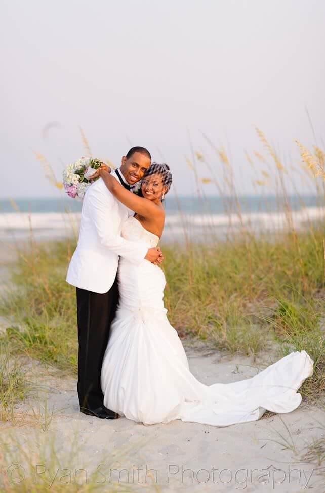 Bride and groom in front of the ocean