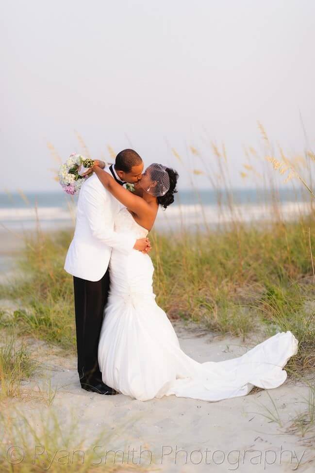 Bride and groom in front of the ocean