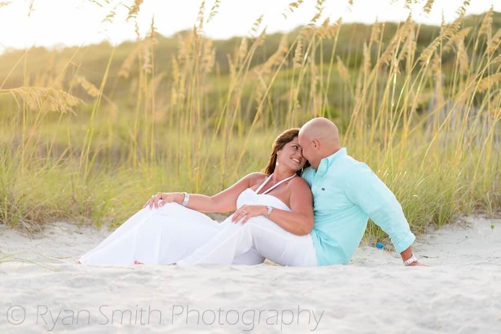 Couple smiling in front of the sea oats - Myrtle Beach State Park
