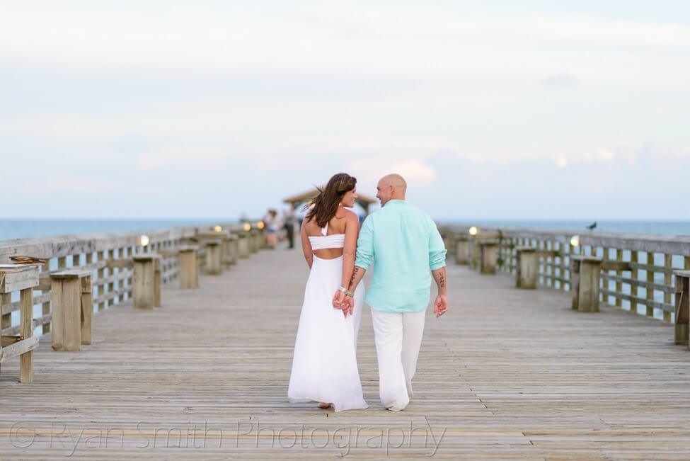 Couple walking down the pier - Myrtle Beach State Park