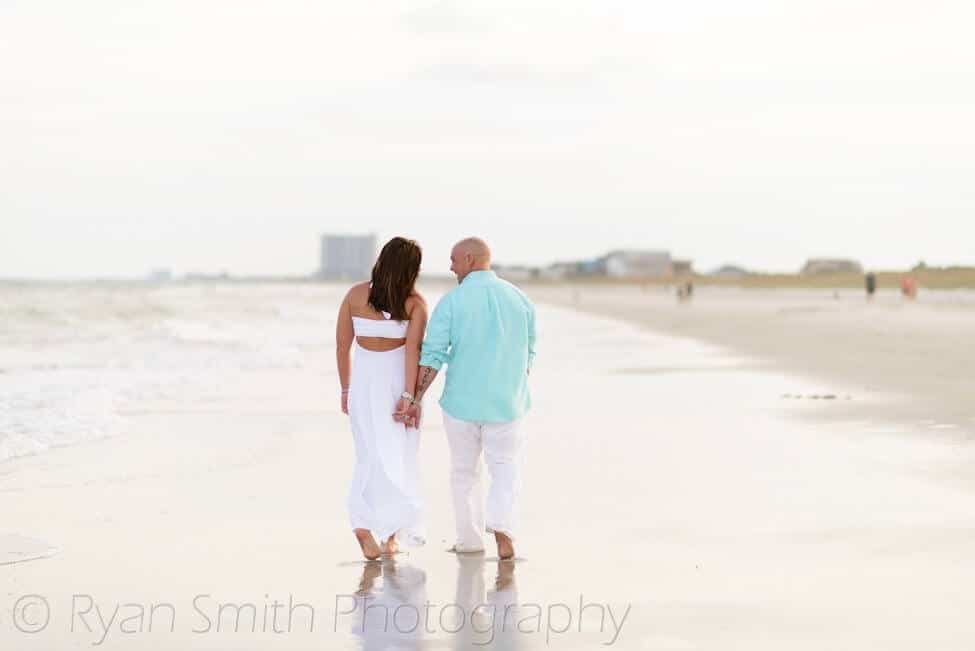 Couple walking together down the beach - Myrtle Beach State Park