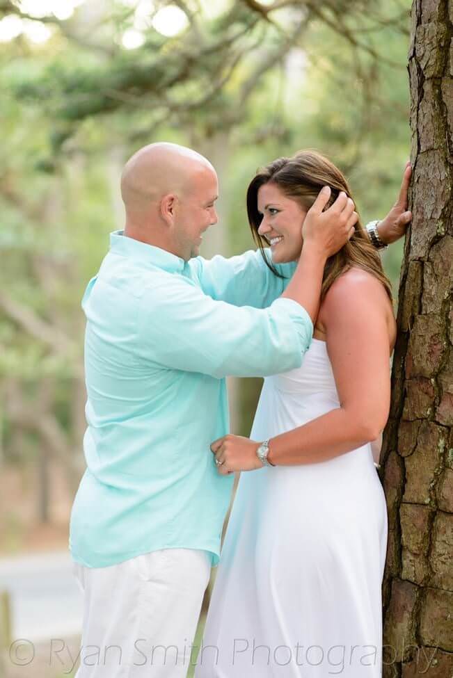 Happy couple leaning against a tree - Myrtle Beach State Park