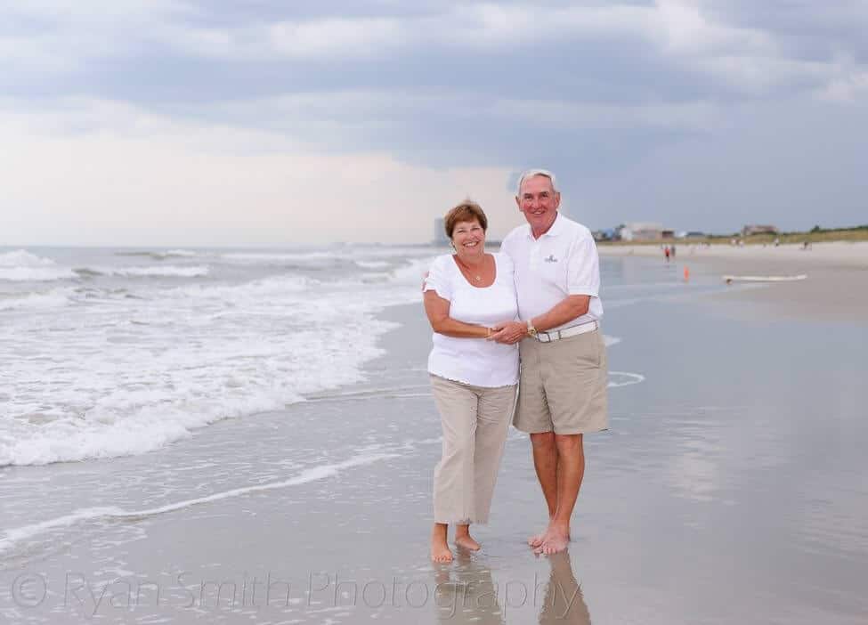 Older couple walking down the beach - Myrtle Beach State Park