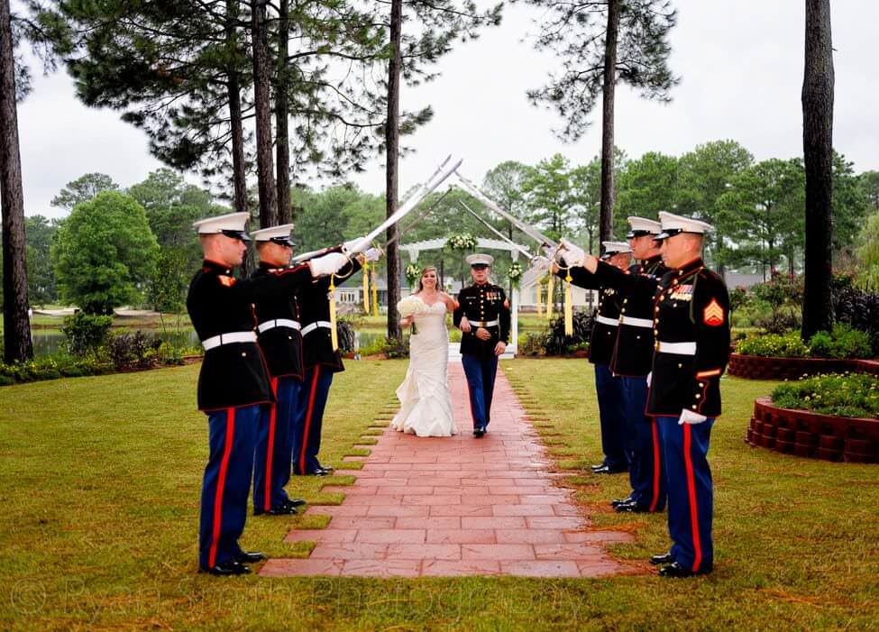 Couple walking under military swords - Brunswick Plantation, NC