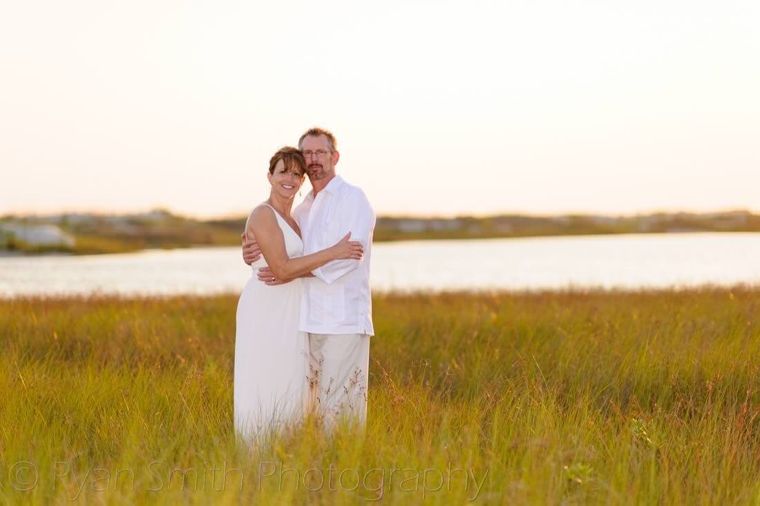 Bride and groom in the tall grass - Holden Beach, NC