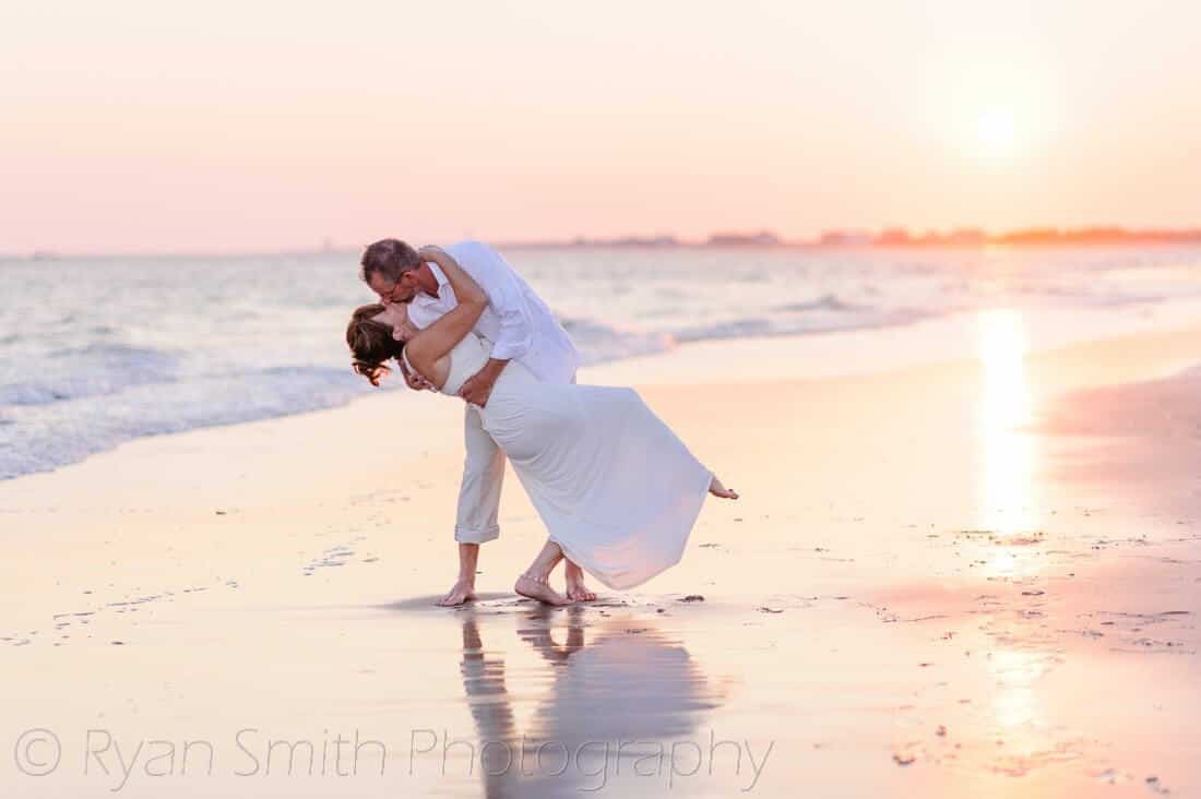 Leaving bride back for a kiss in the sunset - Holden Beach, NC