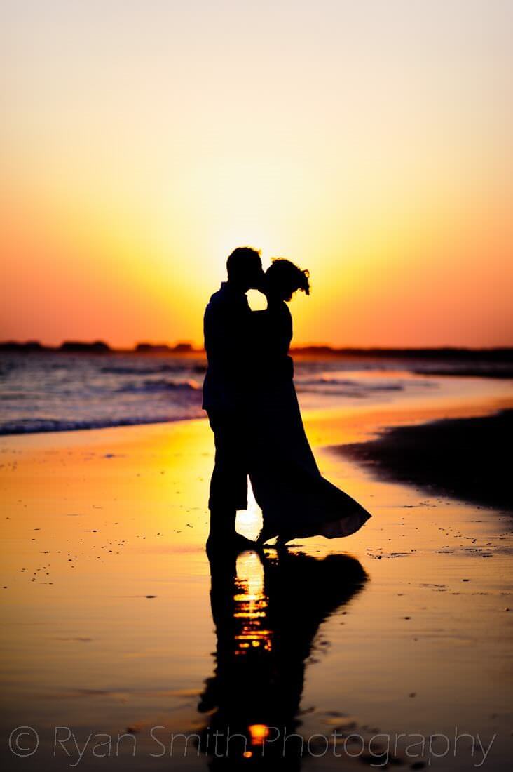 Fun sunset pictures with the bride and groom at Holden Beach, NC