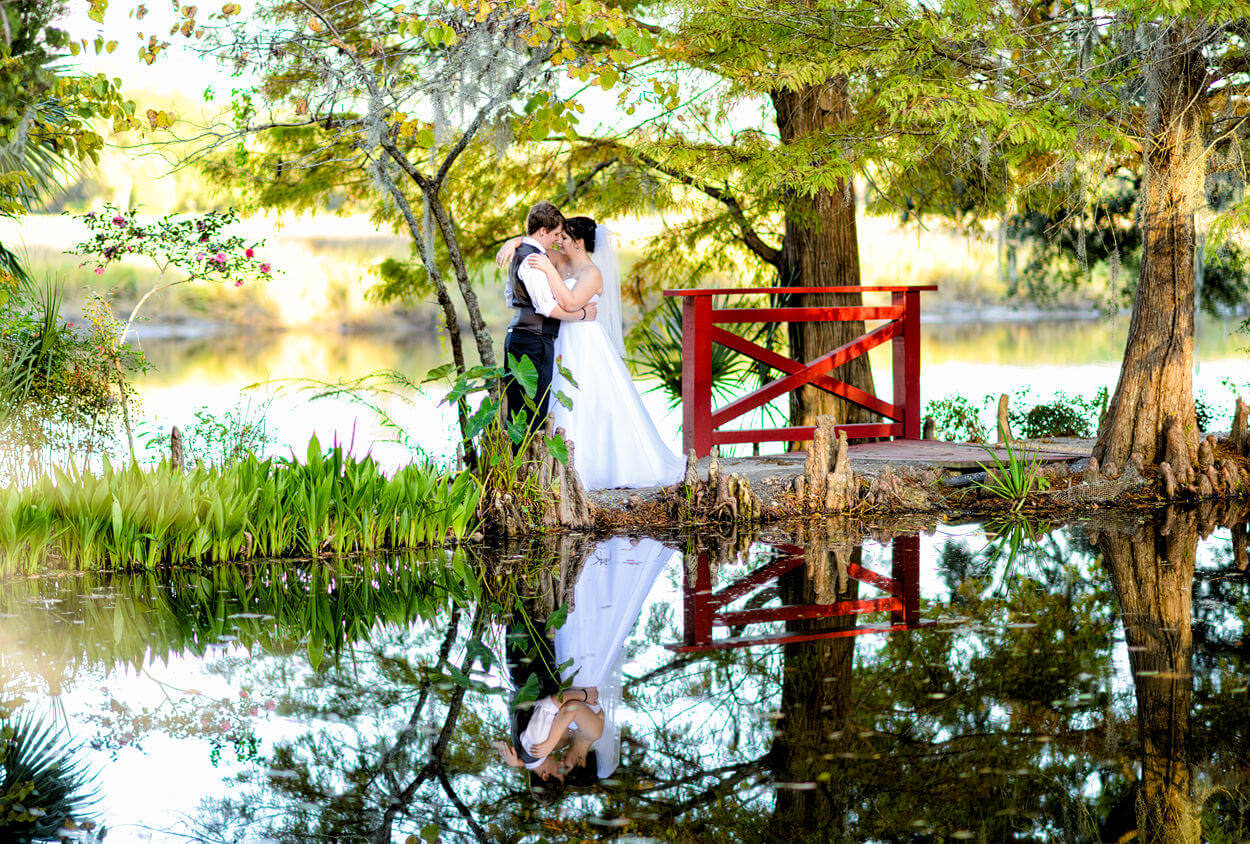 Young couple reflecting in the lake at Magnolia Plantation