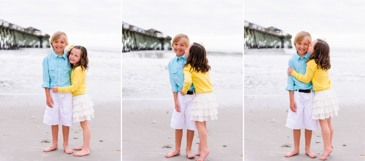 Little sister giving brother a kiss on the cheek