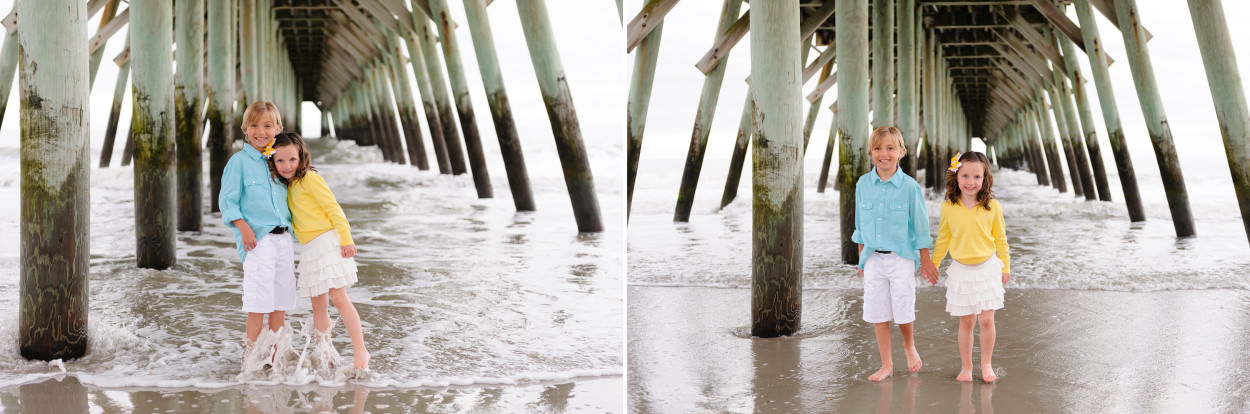 Brother and sister holding hands under the pier