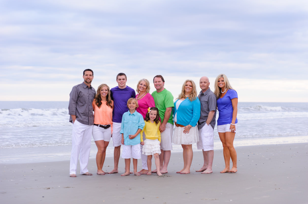 Family portrait in front of a pretty cloudy overcast sky