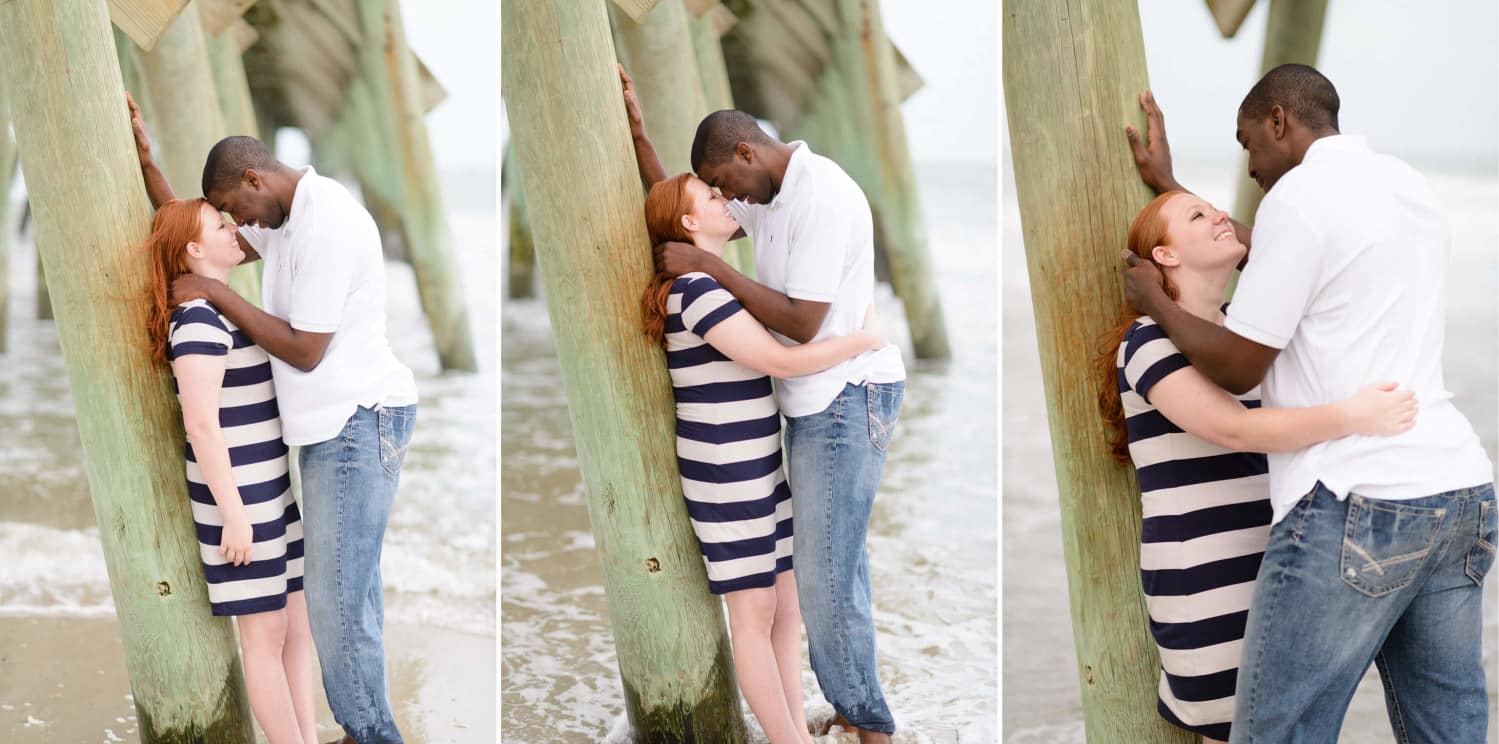 Couple leaning against pier