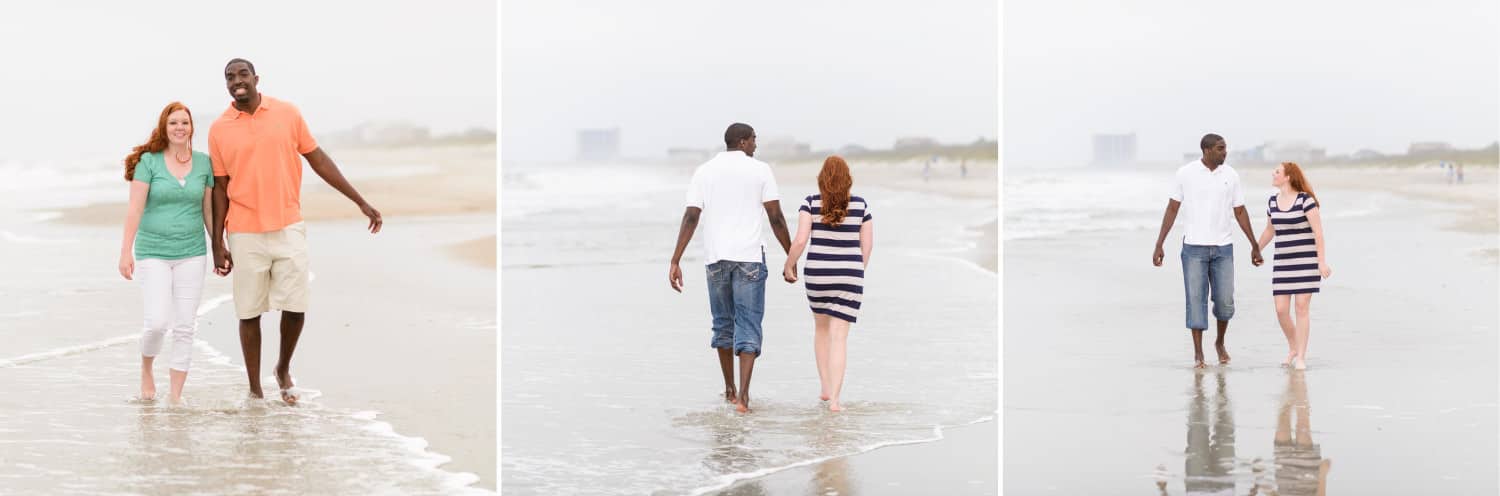 Engagment portrait of mixed race couple walking down the beach