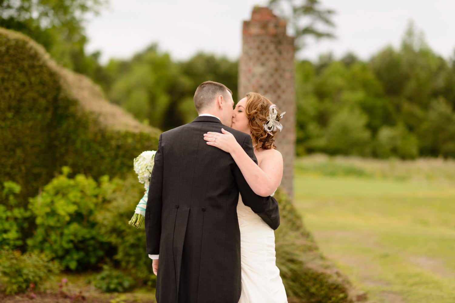 Bride and groom kissing right after first look - Barefoot Resort