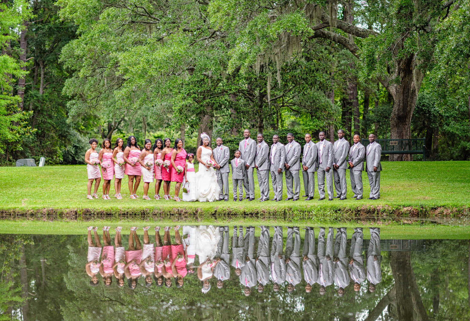 Beautiful wedding party pictures reflecting in the lake at the Holiday Cottage in Brookgreen Gardens