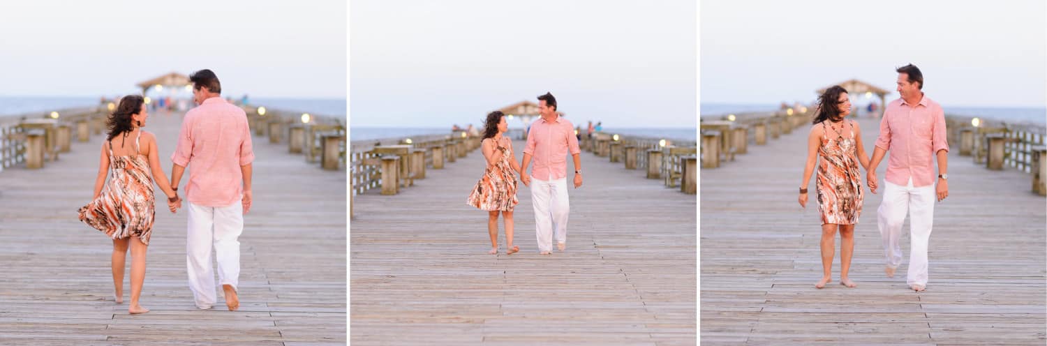 Couple walking together down the pier