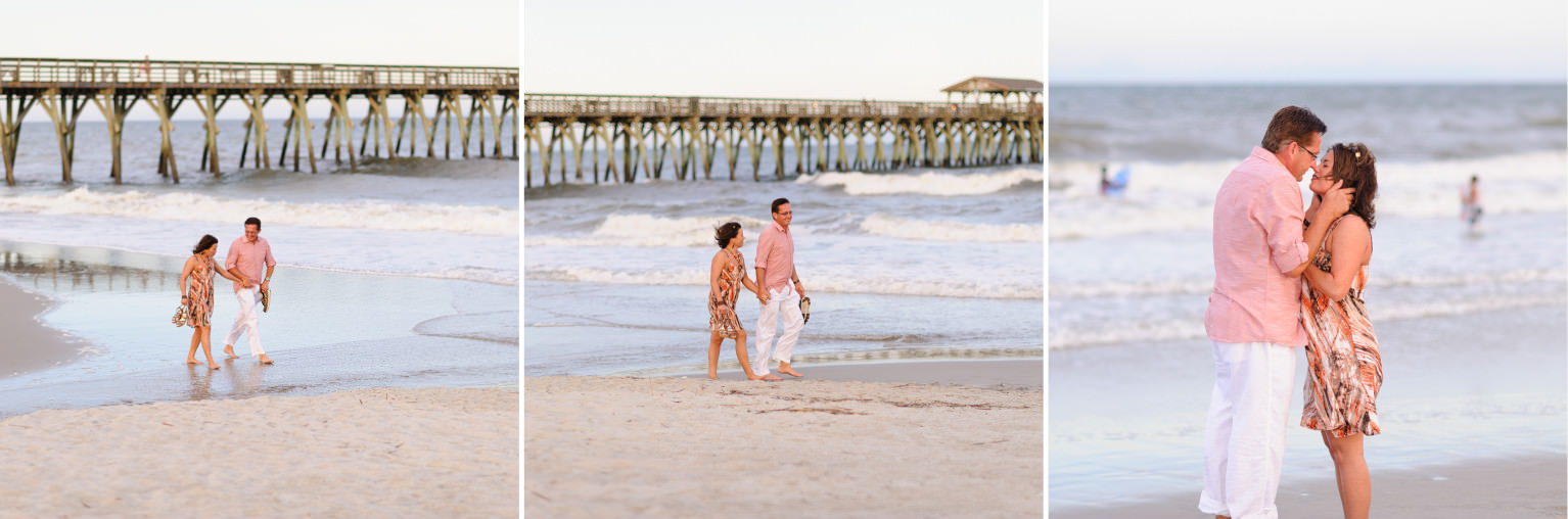 Couple walking down the beach before proposal