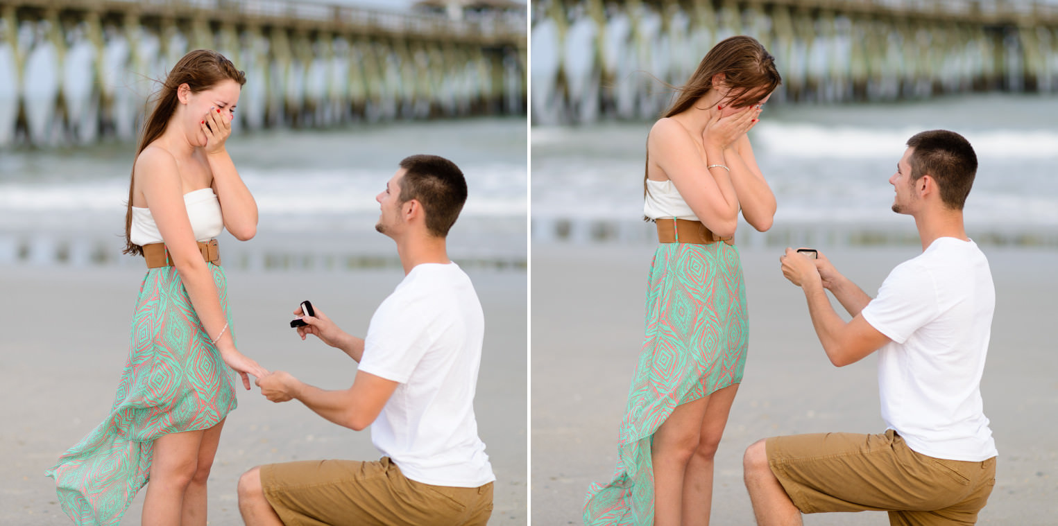Putting on the engagement ring in front of the pier