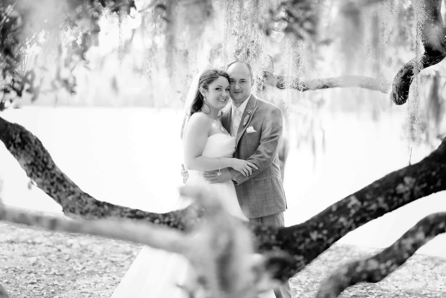 Couple under the moss in the oak trees Wachesaw Plantation