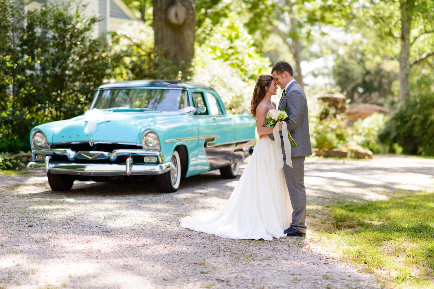 Couple in front of classic car