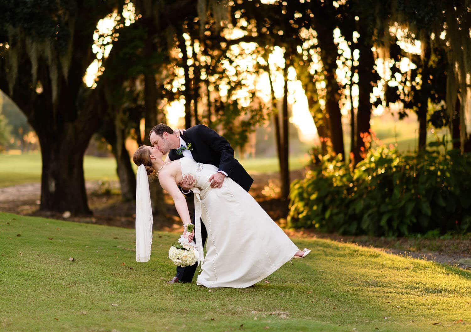 Dipping the bride back in front of the sunset