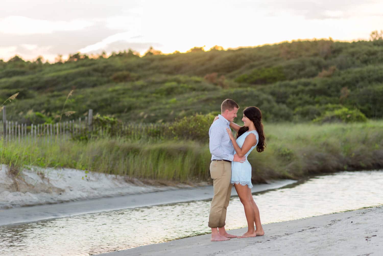 Sunset engagement portrait in front of the dunes at the Myrtle Beach State Park