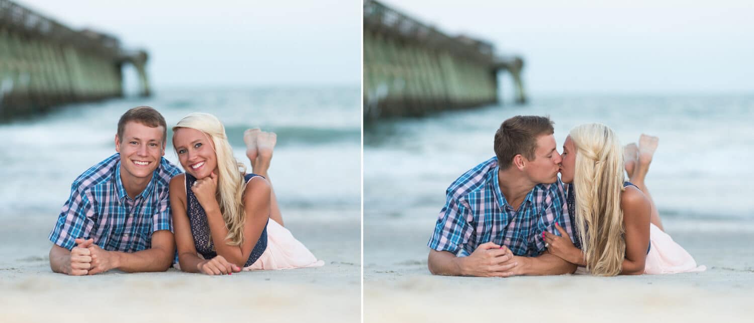 Couple laying beside each other in the sand looking up