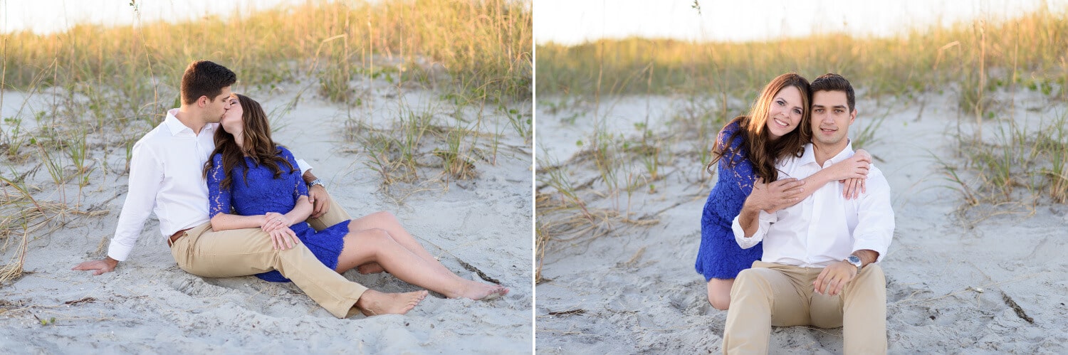 Couple kissing laying together in front of the dunes