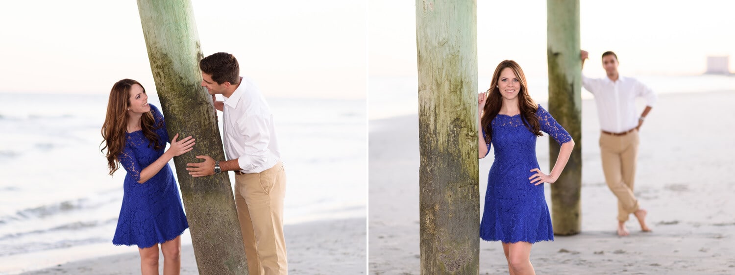 Couple having fun peeking around pier together