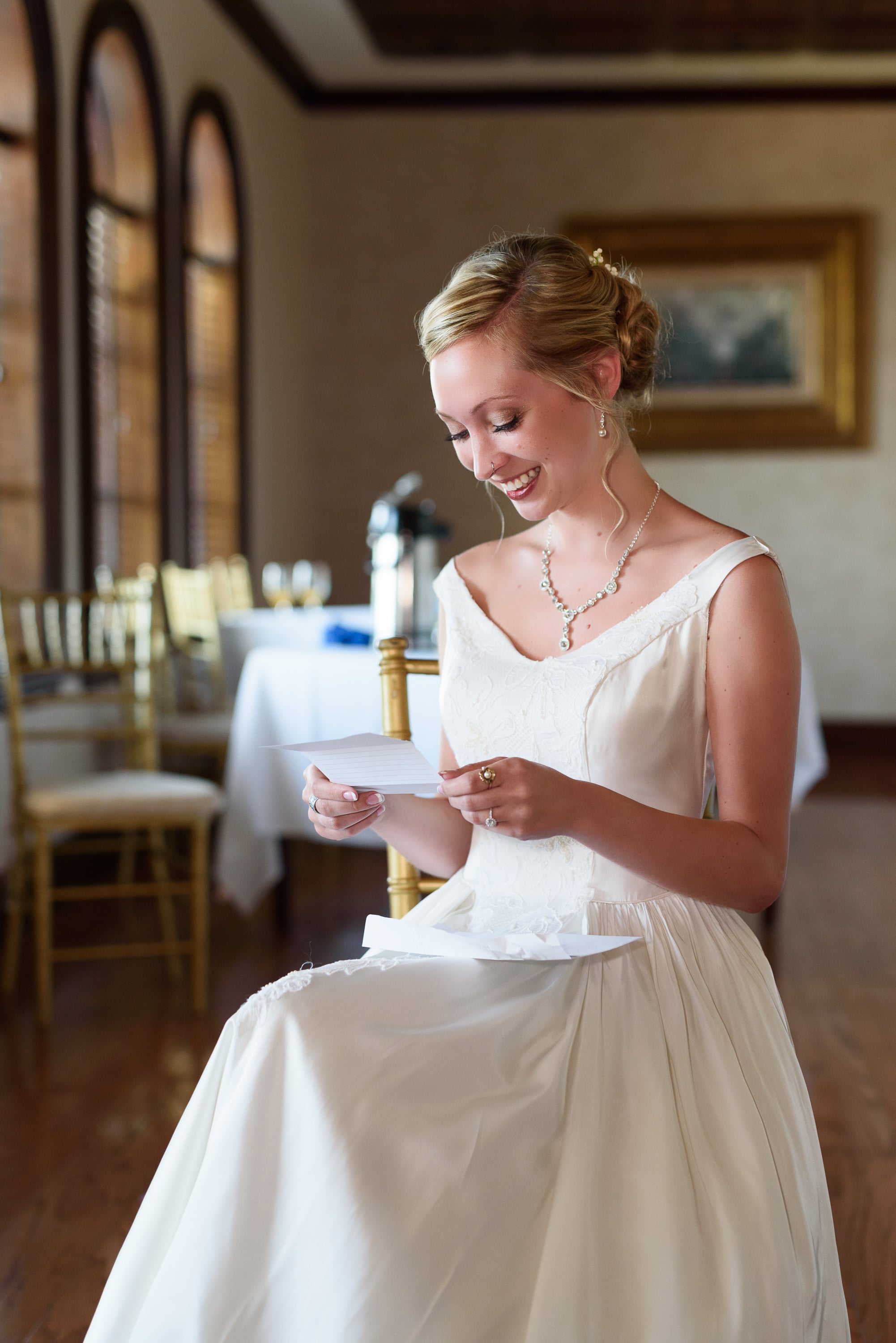 Bride reading a letter from her groom before the ceremony -  Grande Dunes Ocean Club